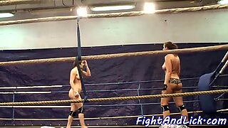 Bigtit lesbians wrestling in a boxing ring